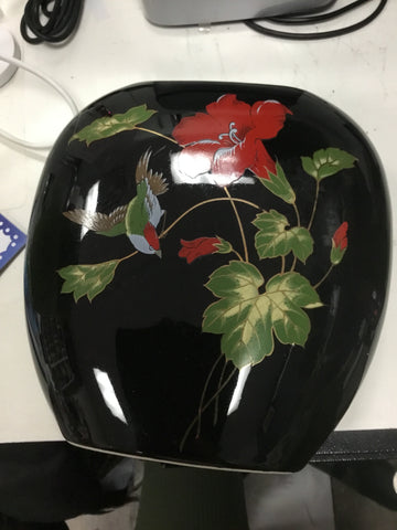 Black red and green pottery piece