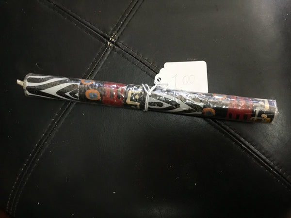 Long candle with African design