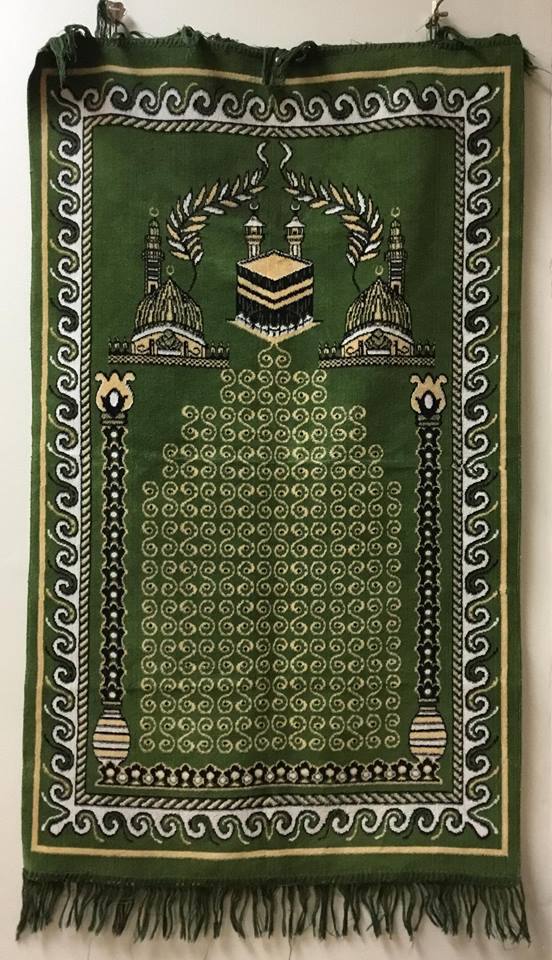 Green prayer rug