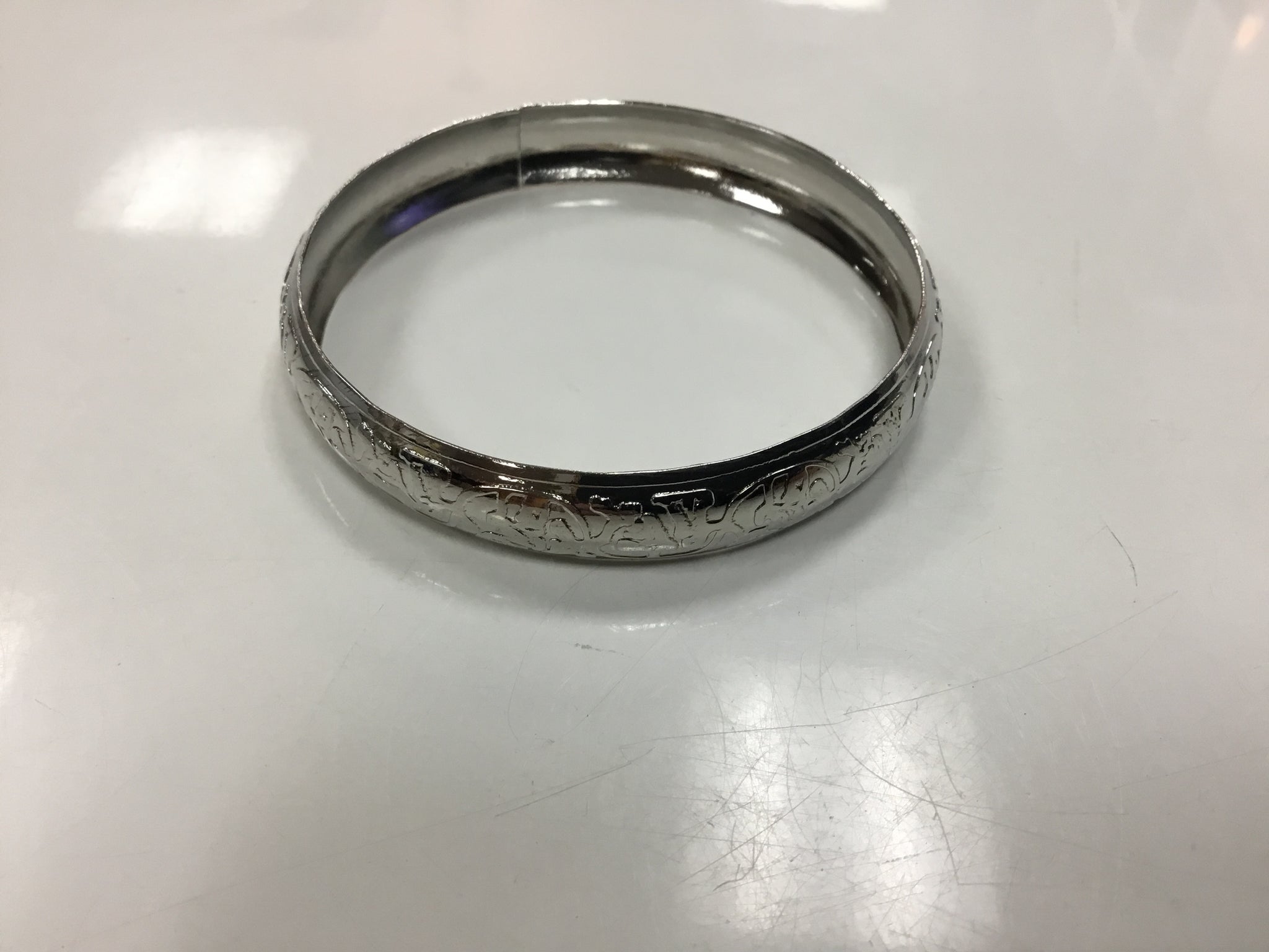 Silver like bracelet and Gold Pouch