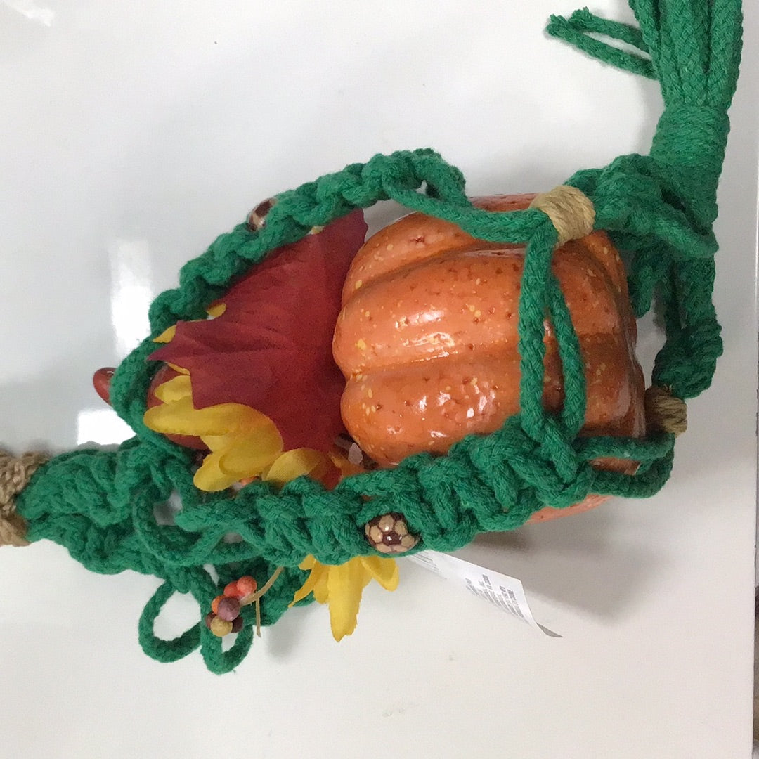 Green macrame with pumpkin