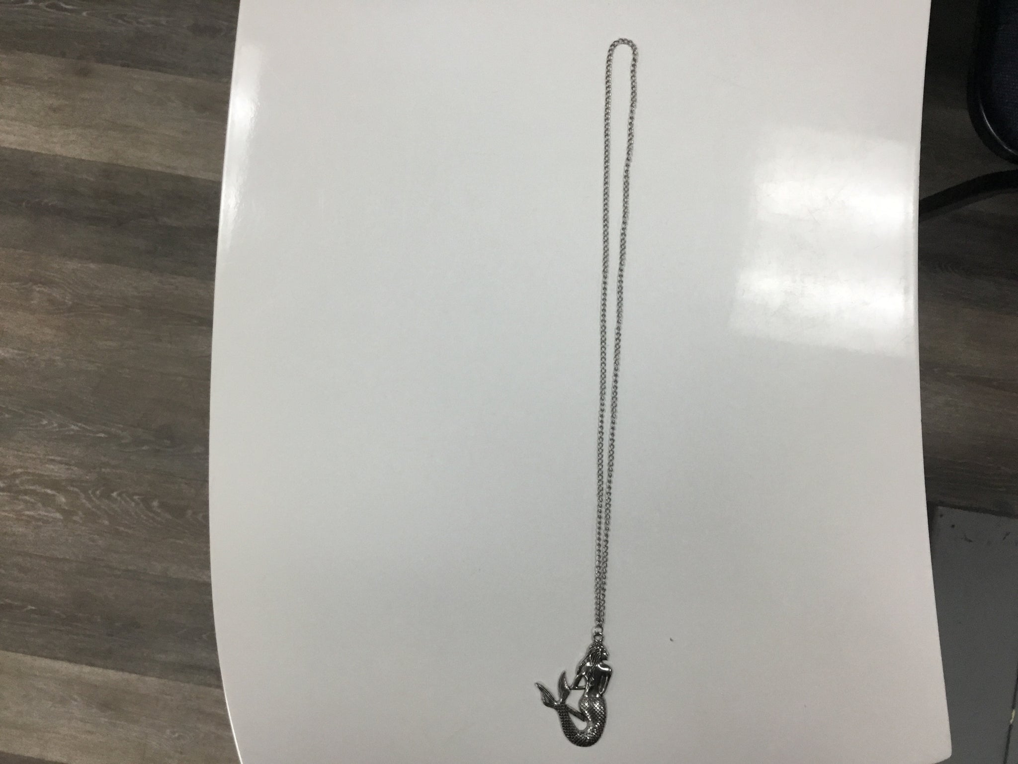 Long necklace with siren pendant
